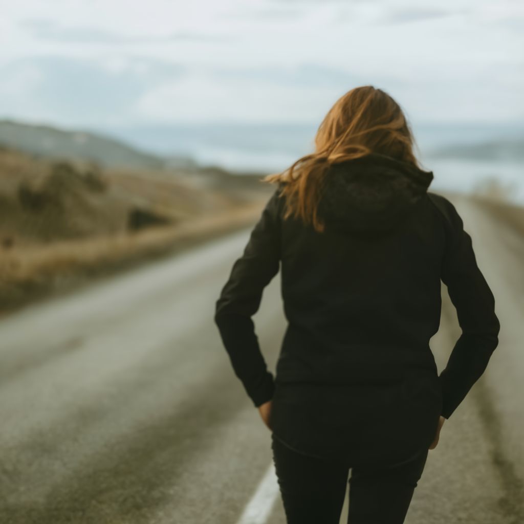 A woman walking on a road